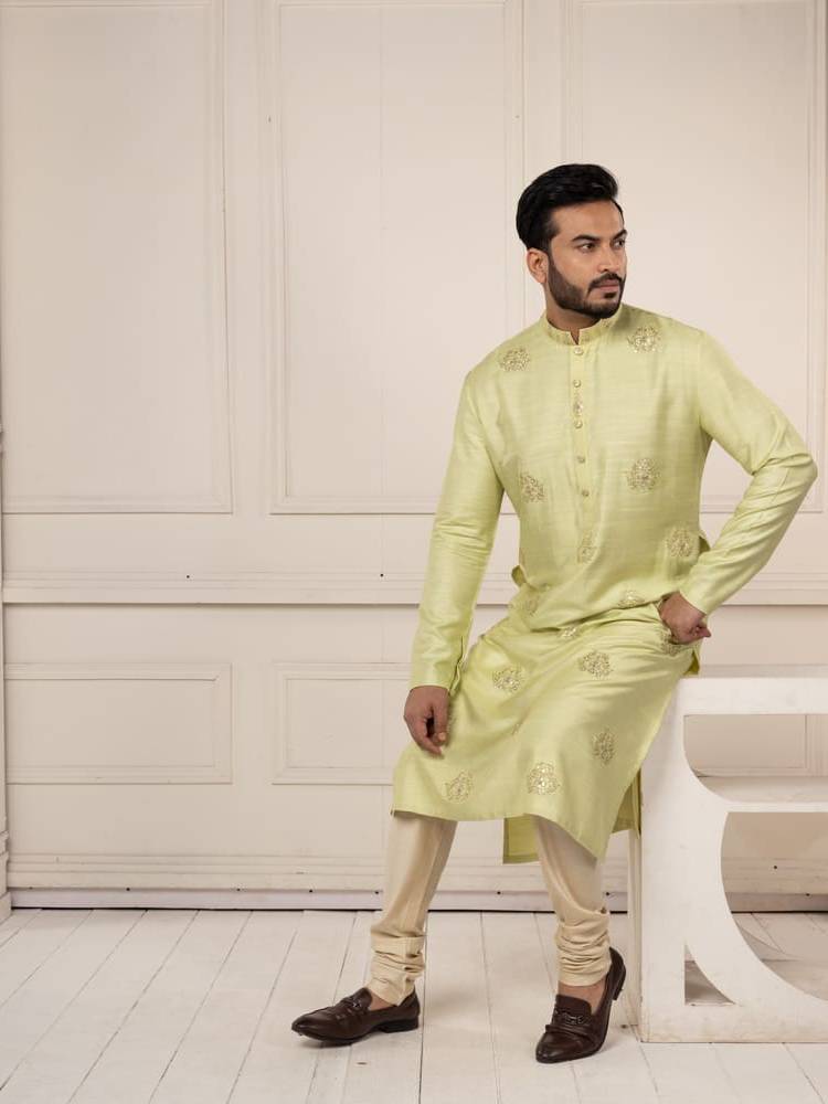 Pastel green kurta with gota work paired with churidar